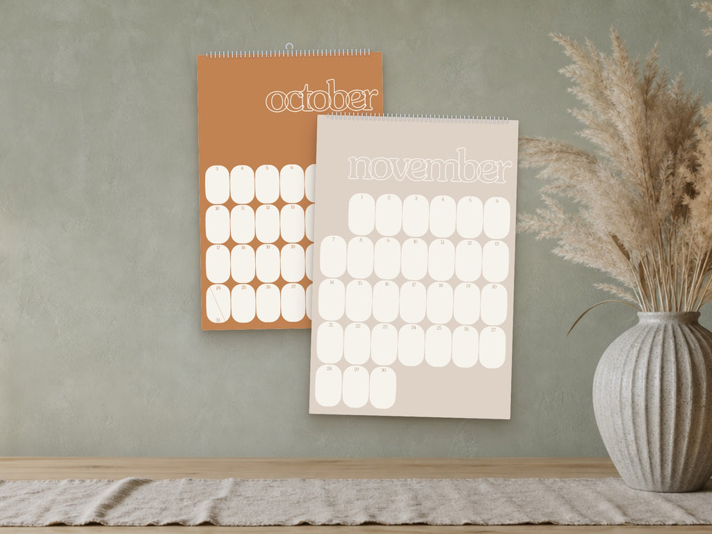 2027 Mid-Century Modern wall calendar, muted retro colours, October and November shown on a wall