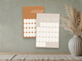2027 Mid-Century Modern wall calendar, muted retro colours, October and November shown on a wall