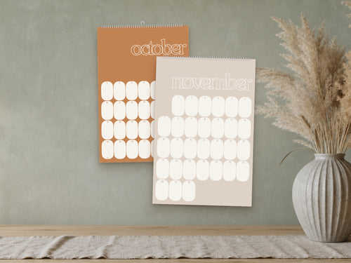 2027 Mid-Century Modern wall calendar, muted retro colours, October and November shown on a wall