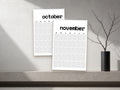 2027 Minimal wall calendar, black and white, October and November shown on a wall